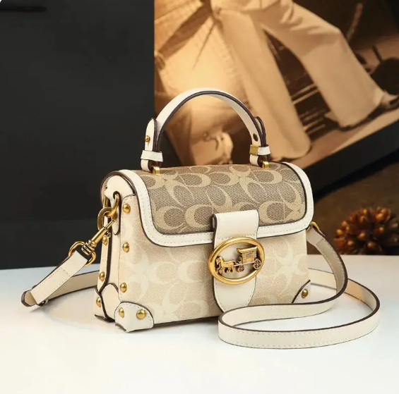 The Signature Charm Satchel